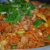 Indian Fried Rice · Stir-fried rice with your choice of protein and lots of spices from India together with onio...