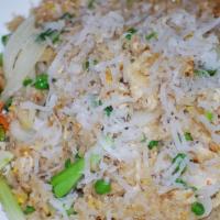 Coconut Fried Rice · Coconut flavored rice stir-fried with your choice of protein, onions, green peas, eggs, and ...