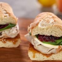 Nick Turkey · Sliced all natural roasted turkey breast, provolone cheese, spinach, cranberry chutney & Hon...