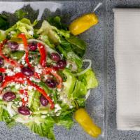 Ragazzi Salad · Fresh romaine lettuce topped with roasted red peppers, green peppers, onions, feta cheese, k...