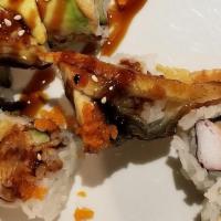 Dragon Roll · Tempura shrimp, cucumber top with eel and avocado, sesame seed,masago eel sauce.
