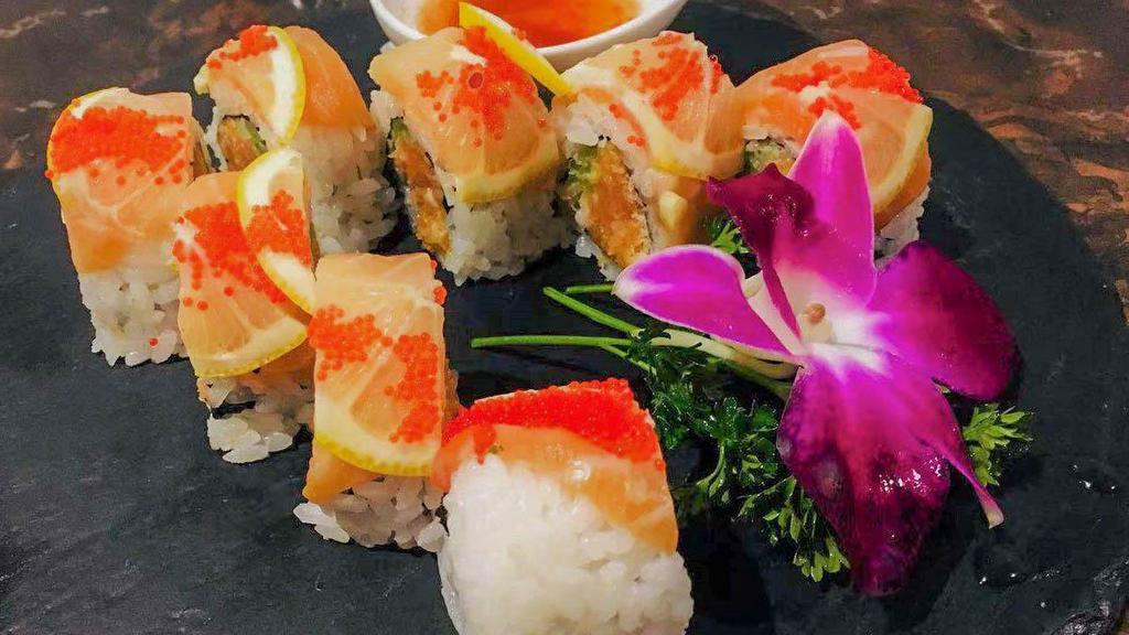 Salmon Lover · Spicy salmon, cucumber, daikon sprout, top with fresh salmon, thinly sliced lemon, red tobiko served with spicy ponzu sauce on the side.