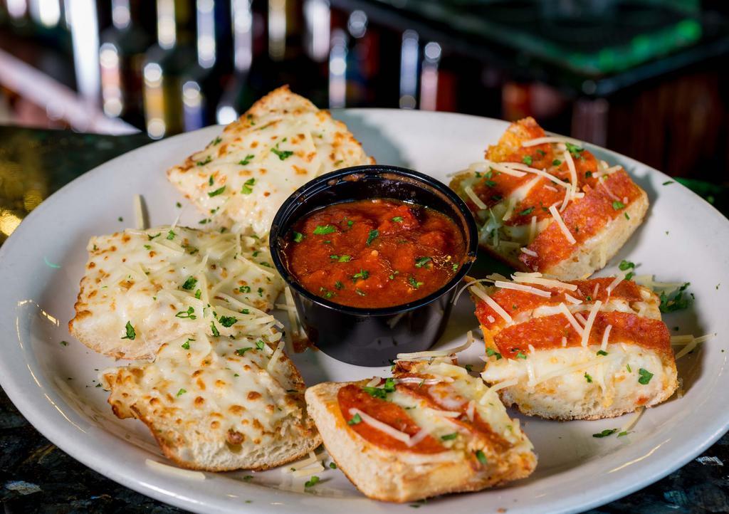 Schmeezy Bread · Fresh-baked bread blasted with Cheesy Garlic Goodness & served with a Side of Dunking Sauce.