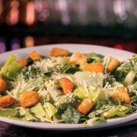 Caesar Schmaesar · Fresh romaine lettuce tossed in our creamy Schmaesar dressing, finished with shredded Parmes...