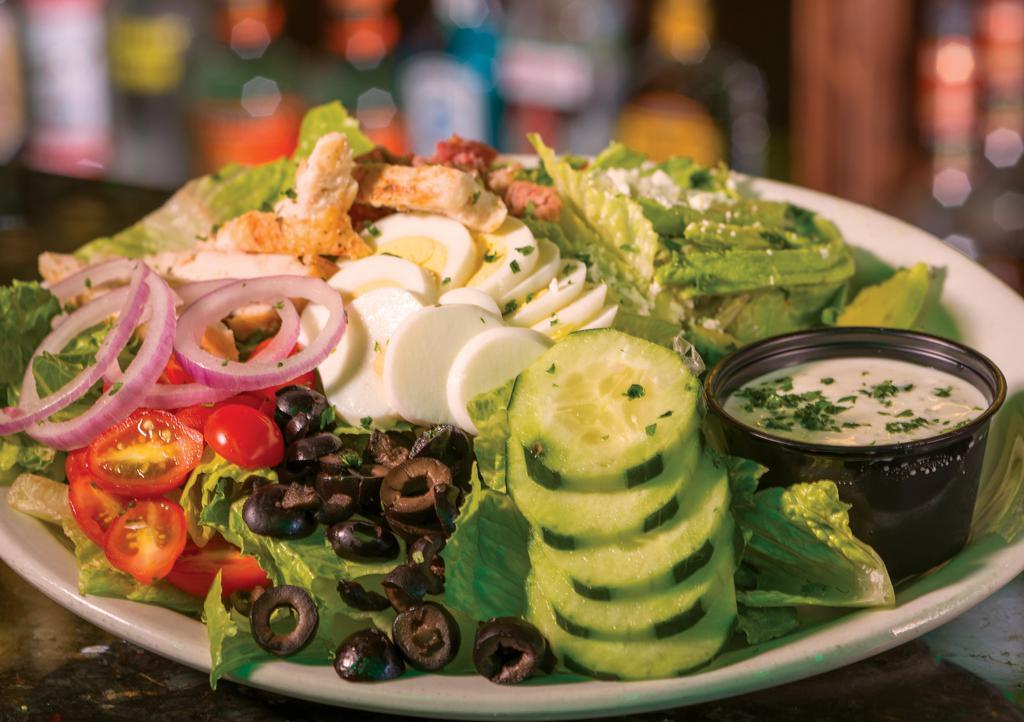 Cobb Salad · Grilled Chicken, Tomatoes, Avocado, Bacon, Red Onion, Black Olives, Cucumbers, Feta & an Egg on a bed of Romain with Bleu Cheese or Ranch Dressing.