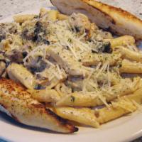 Steak Strip Alfredo · Tender mesquite beef strips and pan-fried mushrooms with penne pasta finished with our cream...