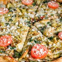 Green Chicken Pie Pizza · Garlic chicken strips marinated in pesto sauce, baby spinach leaves, Mediterranean artichoke...