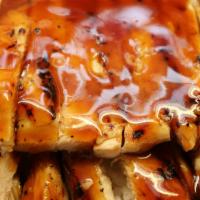 Chicken Teriyaki · Delicious Chicken Teriyaki served with steamed rice, salad. and sauce!