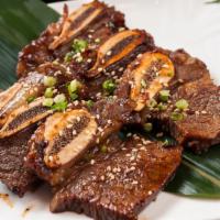 Beef Short Ribs (Kalbi) · Juicy grilled beef short ribs (kalbi) served with steamed rice and salad!