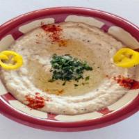 Baba Ghanouj Appetizer · Freshly baked and mashed eggplant with garlic tahini sauce, lemon juice topped with olive oi...