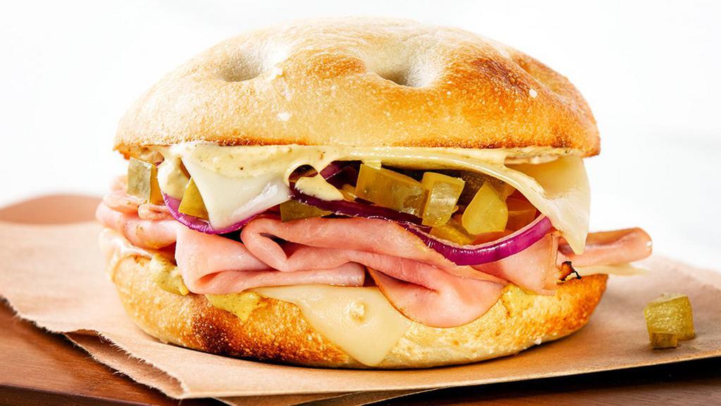 Up In Smoked Ham · A fresh-baked  sea salt focaccia roll topped with shaved ham, melted Swiss cheese, chopped pickles, mustard and Smoky Chipotle Aioli.