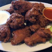 10 Buffalo Wings  · Breaded wings with bleu cheese dressing, frank's red hot sauce and celery sticks.