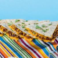 Chorizo Quesadilla · Chorizo and shredded melted cheese in a crispy flour tortilla and served with a side of sour...