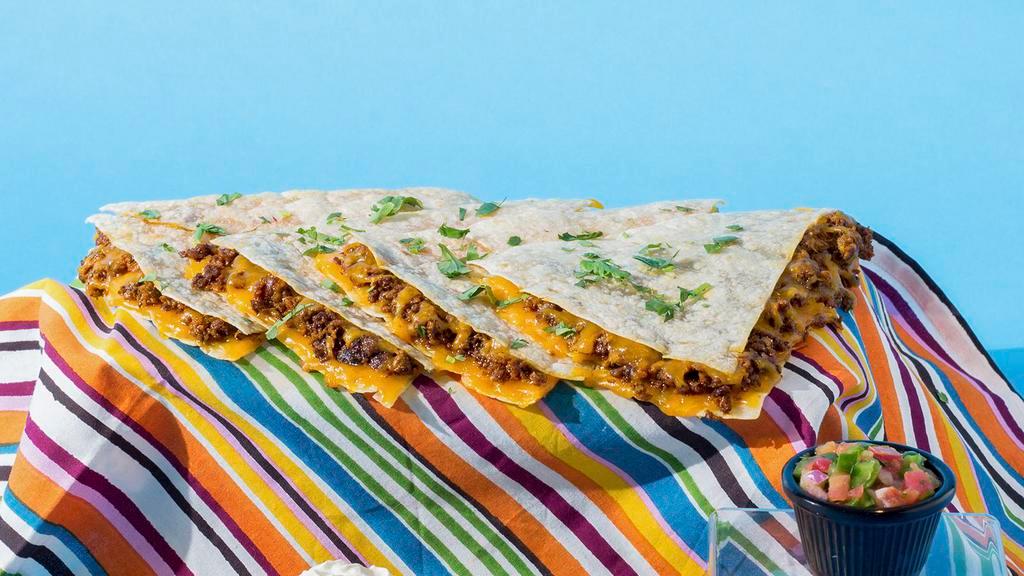 Chorizo Quesadilla · Chorizo and shredded melted cheese in a crispy flour tortilla and served with a side of sour cream.