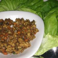 Chicken Lettuce Wraps · Butter lettuce, ground chicken, carrot, and onion.