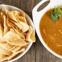 Chili Verde & Chips · Bag of chips and generous helping of our amazing Chili Verde to enjoy