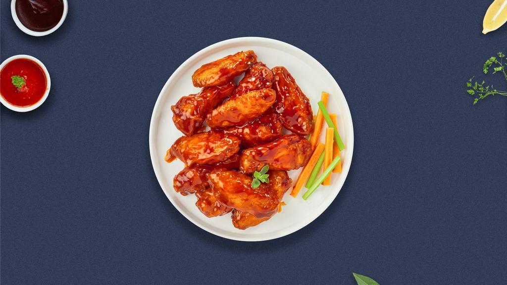 Garlic Manic Buffalo Wings · Breaded or naked fresh chicken wings, fried until golden brown, and tossed in garlic and buffalo sauce. Served with a side of ranch or bleu cheese.