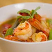 Tom Yum · Hot & sour soup with lemongrass, galangal, kaffir leaves, lime juice, tomatoes, mushroom, an...