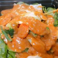 Swimming Rama · Stir-fried garlic, fresh spinach, and topped with our homemade peanut sauce.