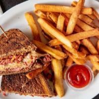 Left Coast Reuben
 · Corned beef sliced thin and stacked high with swiss cheese. housemade sauerkraut and housema...