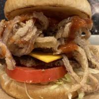 Barbecue Burger · Seasoned ground beef patty piled high with bacon, melted Swiss, frizzled onions and our own ...