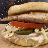 Spicy Chicken Sandwich · A seared chicken breast, shredded lettuce, tomato, sliced red onion, pickled jalapenos and m...