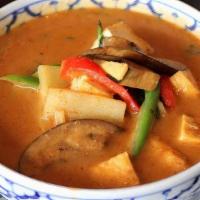 Red Curry · Choice of meat cooked with red curry, coconut milk, sliced bamboo shoots, eggplants, bell pe...
