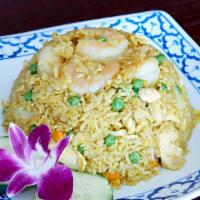 Pineapple Fried Rice  · Fried rice with prawns, chicken, egg mixed with pineapple, carrots, peas, tomatoes, raisin, ...