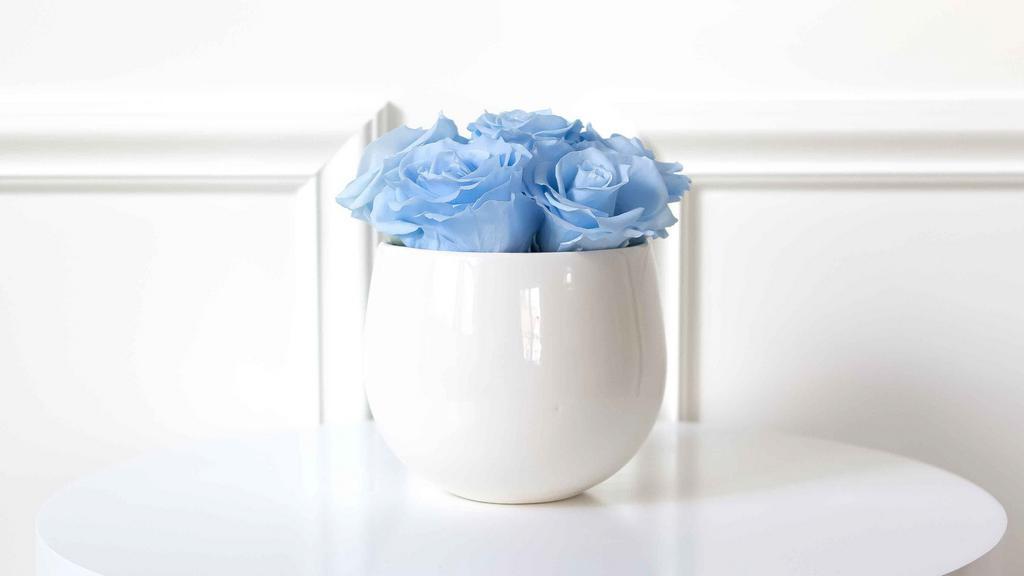 Petite Sonoma Rose Arrangement With Blue Roses · Sonoma includes the most beautiful Premium Preserved Roses, hand-crafted in a creamy white ceramic vase. With this arrangement you’ll get 6-7 roses arranged in a beautiful bowl vase. Our Premium Preserved Rose compositions make for a memorable gift for you or someone special! Vase size: 5