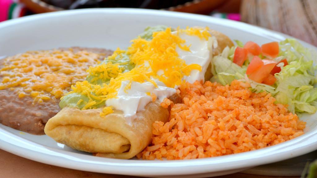 Chimichanga Dinner · Our Chimichangas are delicate and crisp. Choose your filling, we'll roll it in a flour tortilla, deep fry it & top it with sour cream and guacamole. Served with Spanish Rice and Refried Beans.