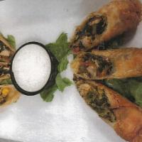Spicy Southwest Eggrolls · Chicken, black beans, corn, pepper-jack cheese, red peppers and spinach blended with southwe...