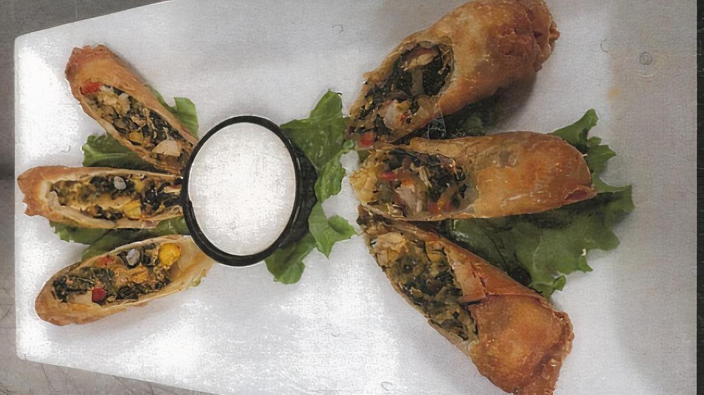 Spicy Southwest Eggrolls · Chicken, black beans, corn, pepper-jack cheese, red peppers and spinach blended with southwestern spices, served with a Cajun ranch dipping sauce.