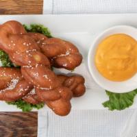 Pub Style Pretzels · Three large pretzels with beer cheese dipping sauce.