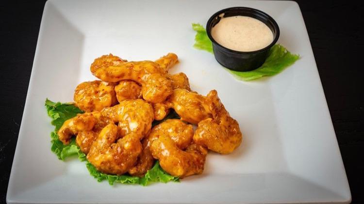 Boom-Boom Shrimp · Golden popcorn shrimp tossed in sweet and tangy sauce.