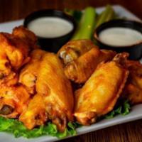 20 Chicken Wings · Jumbo wings tossed in your choice of sauce and served with celery and choice of blue cheese ...