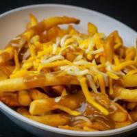 Gravy Fries · Signature fries, brown gravy, cheddar-jack cheese.