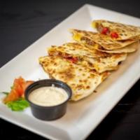Blackened Ribeye Quesadilla · Blackened angus ribeye, blended cheddar-jack cheese, roasted red pepper, red onion, with hor...