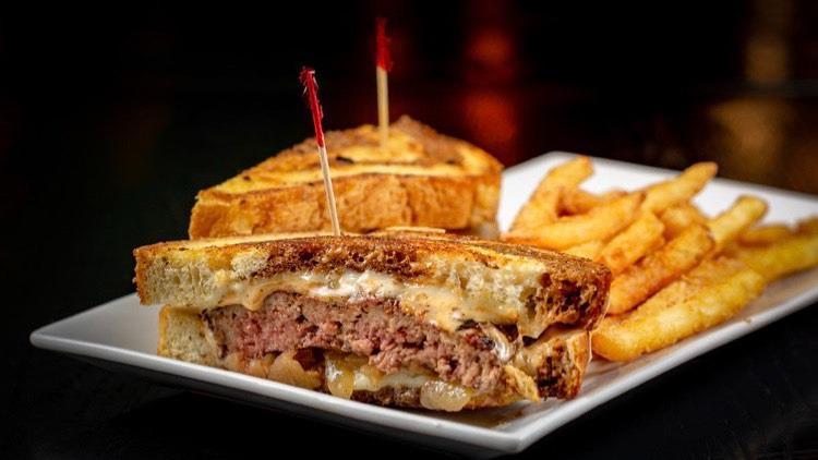 Patty Melt · Not quite a burger but close enough! Char-grilled angus steak burger, swiss cheese, caramelized onion, and 710 sauce on grilled rye.