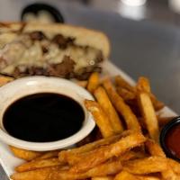 French Dip · Freshly shaved choice ribeye, provolone, horseradish aioli served on a hoagie roll with aus ...