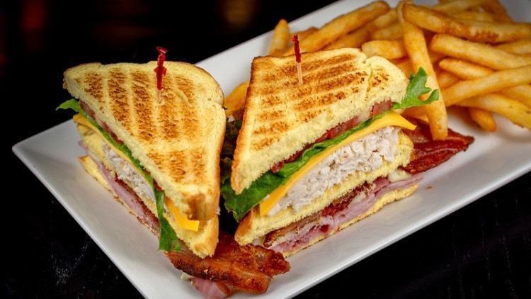 810 Club · Our triple-decker piled high with ham, turkey, applewood bacon, swiss and american cheeses, lettuce, tomato and mayo on potato bread
