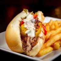 Philly Steak Sandwich · Traditional Philly style shaved steak with onions, peppers and house cheese blend.