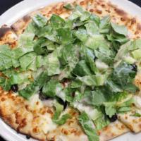 Greek Out · Pizza crust, fresh greens, diced tomato, black olives, red onion, feta cheese finished with ...