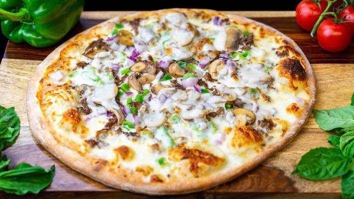 Philly Cheesesteak · Alfredo sauce, shaved angus Philly steak, bell peppers, sweet onions, marinated mushrooms, provolone.