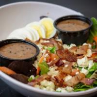 Blue Cheese Bacon Salad · Fresh greens with crumbled blue cheese, hard boiled egg, bacon and diced tomato.