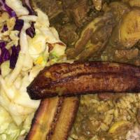 Curry Goat · Served with fried plantain, cabbage and white rice, and rice and peas.