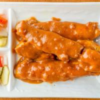 4 Piece Chicken Satay · Skewers of grilled chicken marinated in curry powder and spices. Served with peanut sauce an...