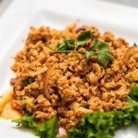 Thai Larb Salad · Minced chicken with green onion, red onion, rice powder, mint leaves, lemongrass and cilantro.