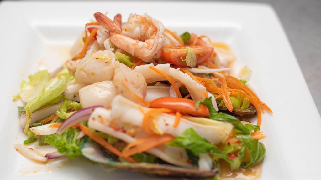 Seafood Salad · Assorted seafood tossed with herbs with a spicy lime dressing.