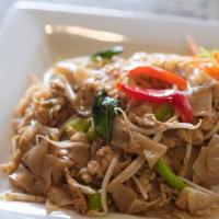 Pad Kee Maw · Drunken noodles. Stir-fried wide rice noodles with a spicy chili sauce, basil leaves, cabbag...