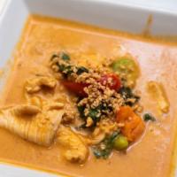 Panang Curry · Thick and rich red curry cooked with coconut milk, kaffir lime leaves, ground peanuts and ba...